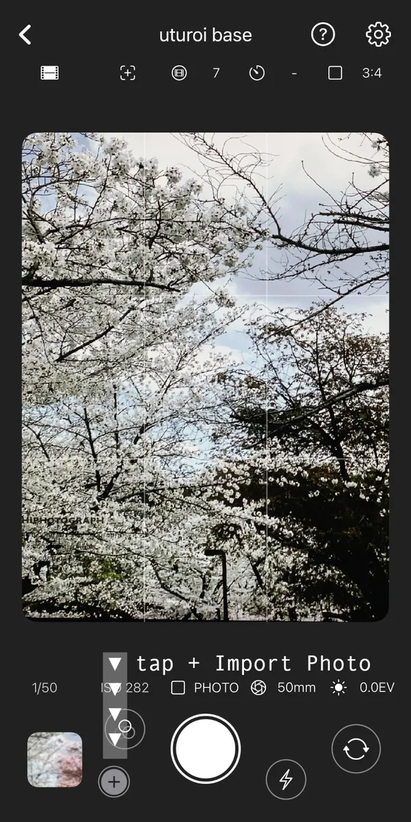 Tapping the import button in the bottom-left corner to open your photo library.